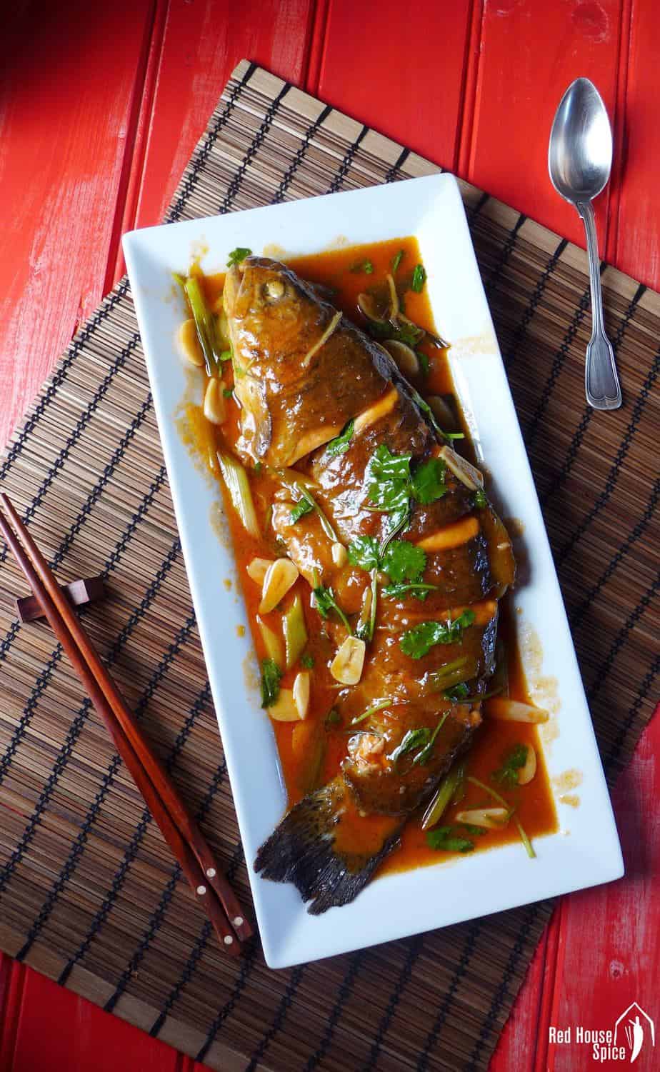 A whole fish cooked with sweet & sour sauce