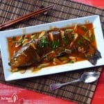 a whole fish cooked with sweet & sour sauce