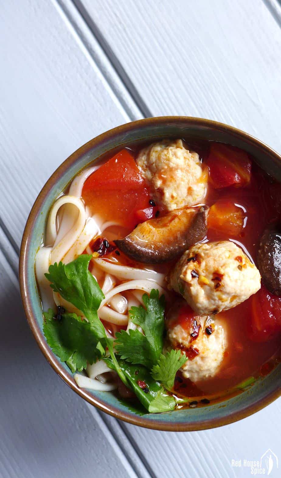 Tender and springy meatballs cooked in tomato and shiitake soup. This chicken meatball noodle soup is super tasty, filling and healthy.