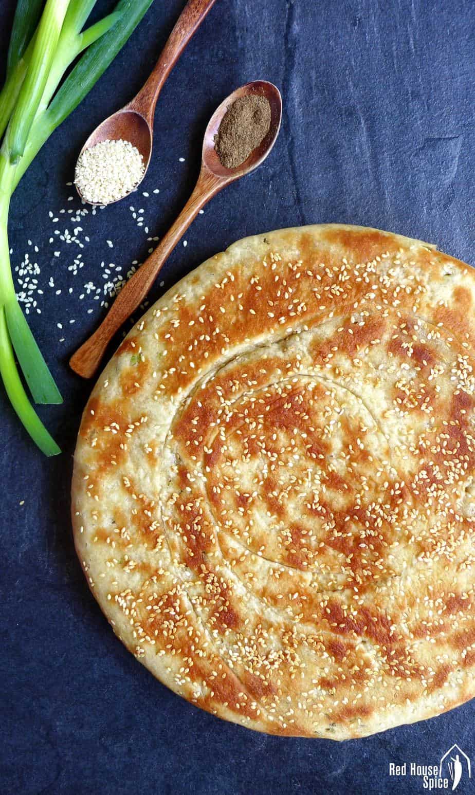Leavened scallion flatbread topped with sesame seeds