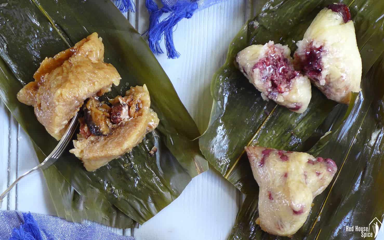 Chinese sticky rice dumplings over bamboo leaves.