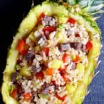 Colourful beef fried rice held in a pineapple shell.