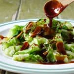 a plate of blanched iceberg lettuce served with oyster sauce