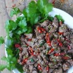 Aromatic and pungent, spicy cumin lamb stir-fry is a dish that seldom fails to impress. This recipe offers two tricks to obtain the perfect texture.