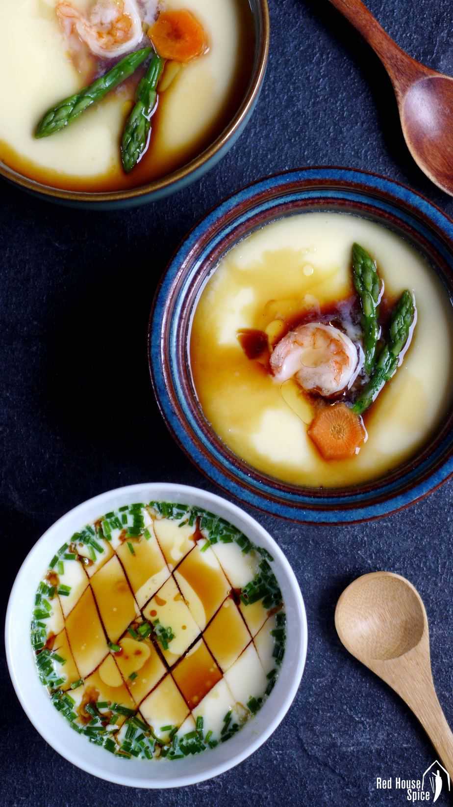 To make basic steamed eggs more visually appetizing, you can garnish it with prawns and vegetables like asparagus, carrot, etc. 