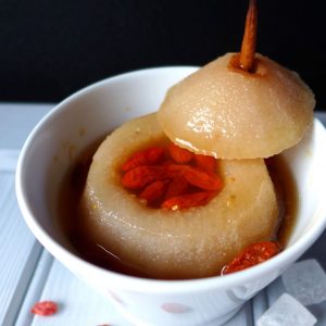 A hollowed pear filled with rock sugar and goji berries.