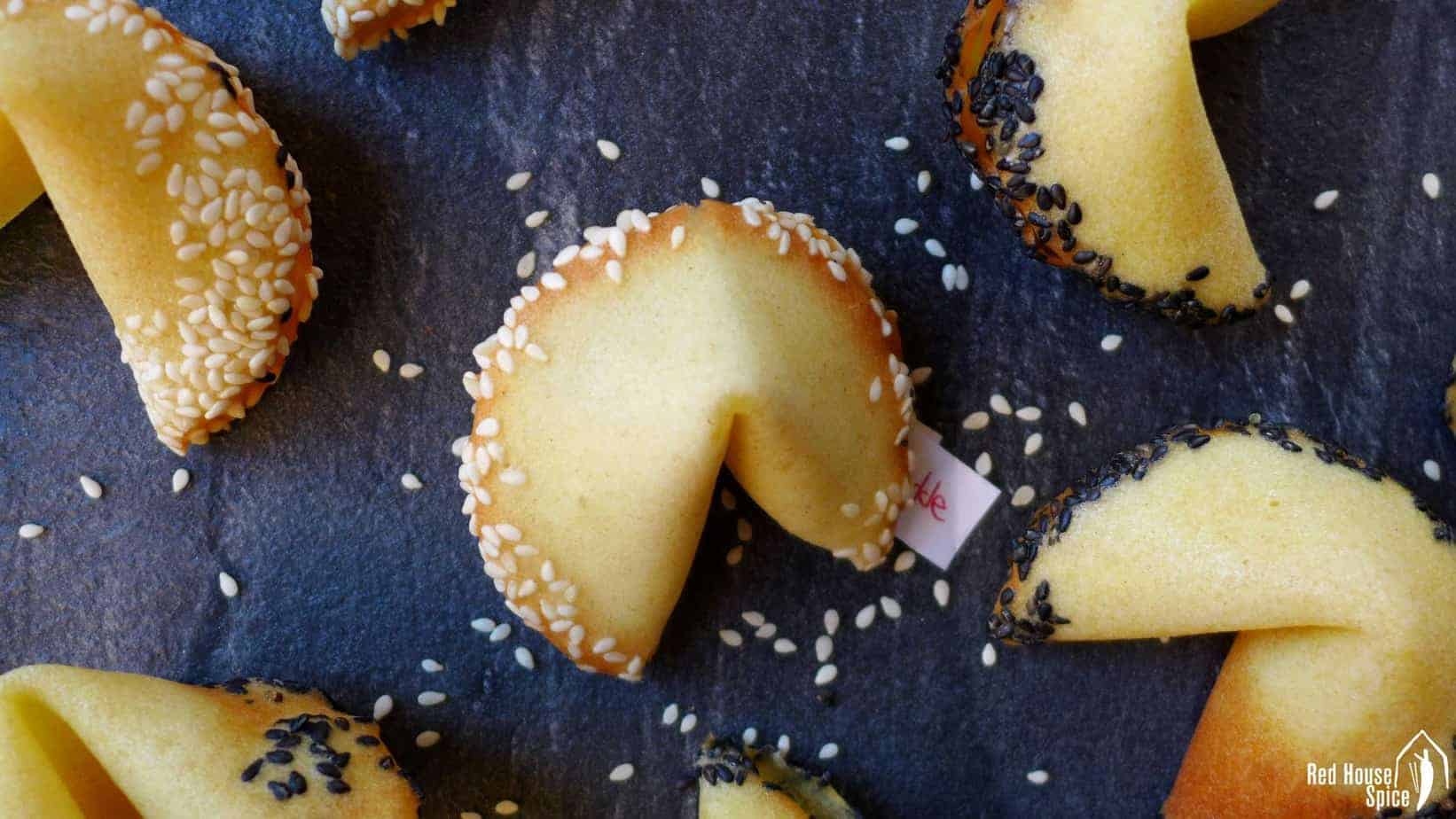 Homemade fortune cookies with sesame rims