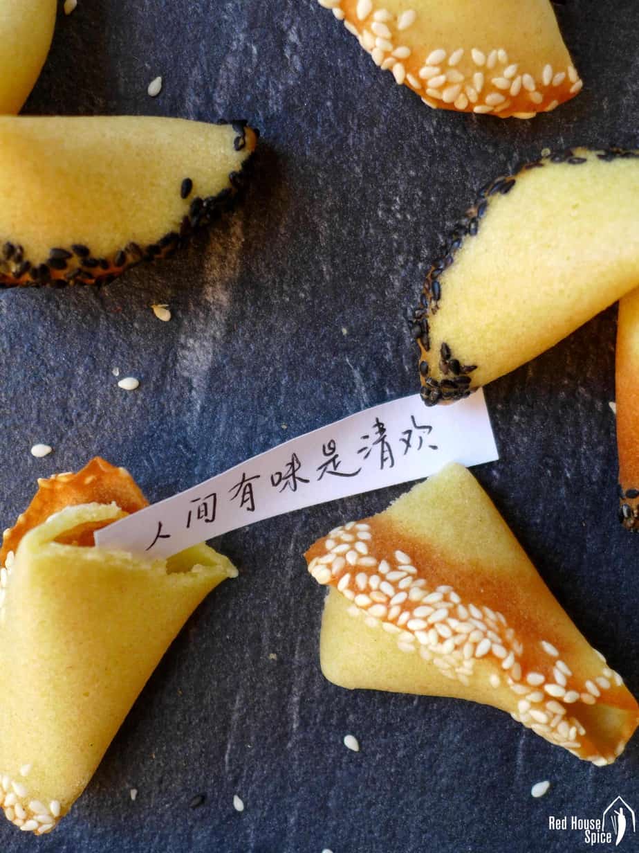A broken fortune cookie showing the message inside