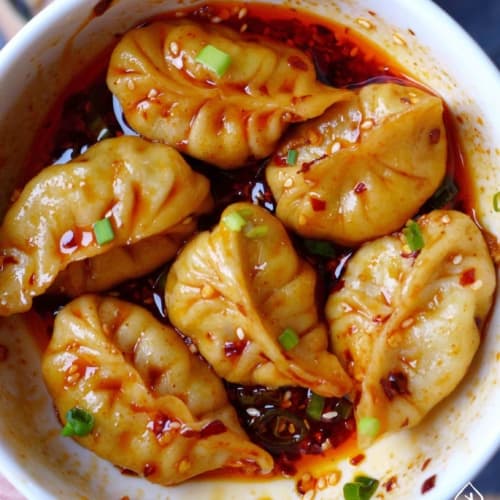 Boiled dumplings in spicy sauce