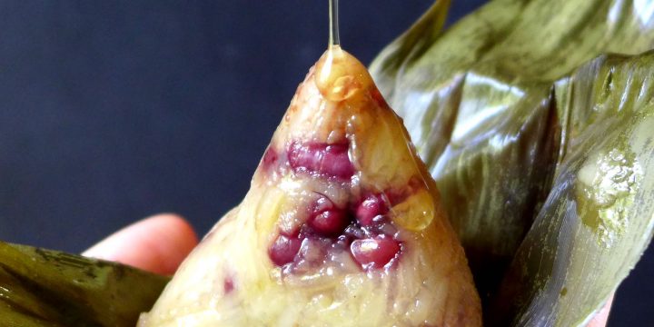 Honey pouring over a sticky rice dumpling