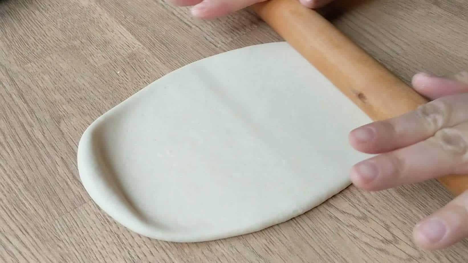 A piece of dough flattened by a rolling pin.