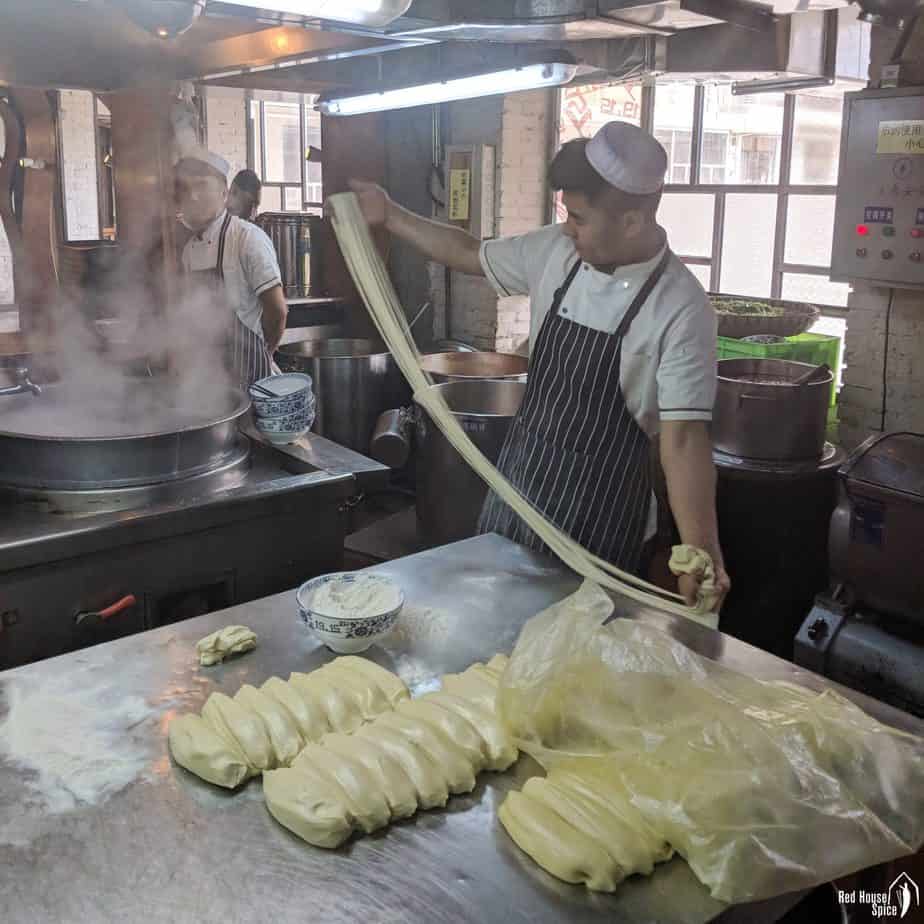 A chef making hand-pulled noodles
