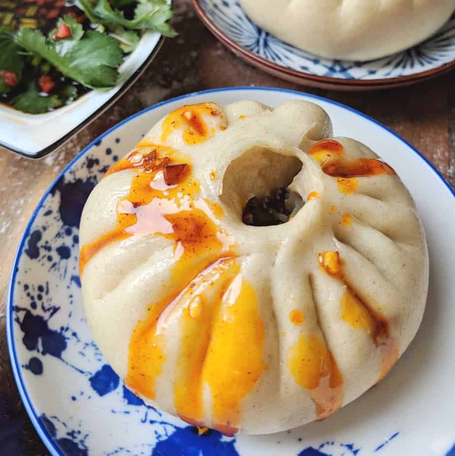 A steamed bao buns dressed with chilli oil