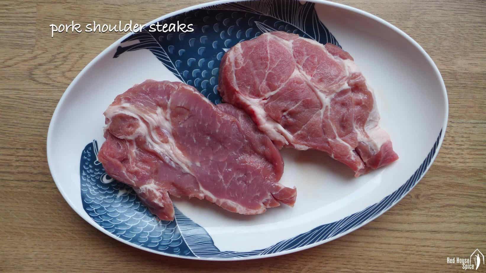 Two pieces of pork shoulder steak