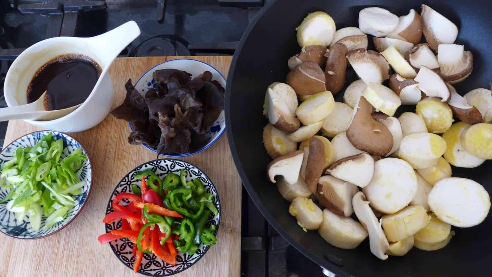Chopped mushrooms and other ingredients for stir-frying