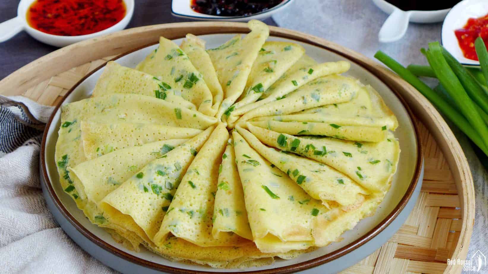 A plate of Chinese egg & scallion crepes