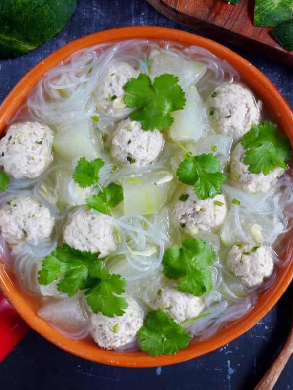 A pot of winter melon soup with meatballs & vermicelli noodles