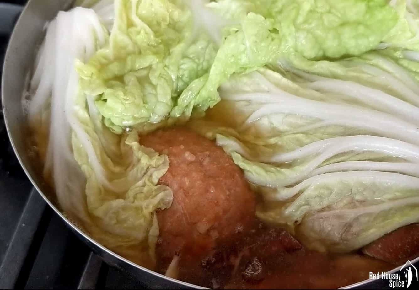 Napa cabbage over meatballs