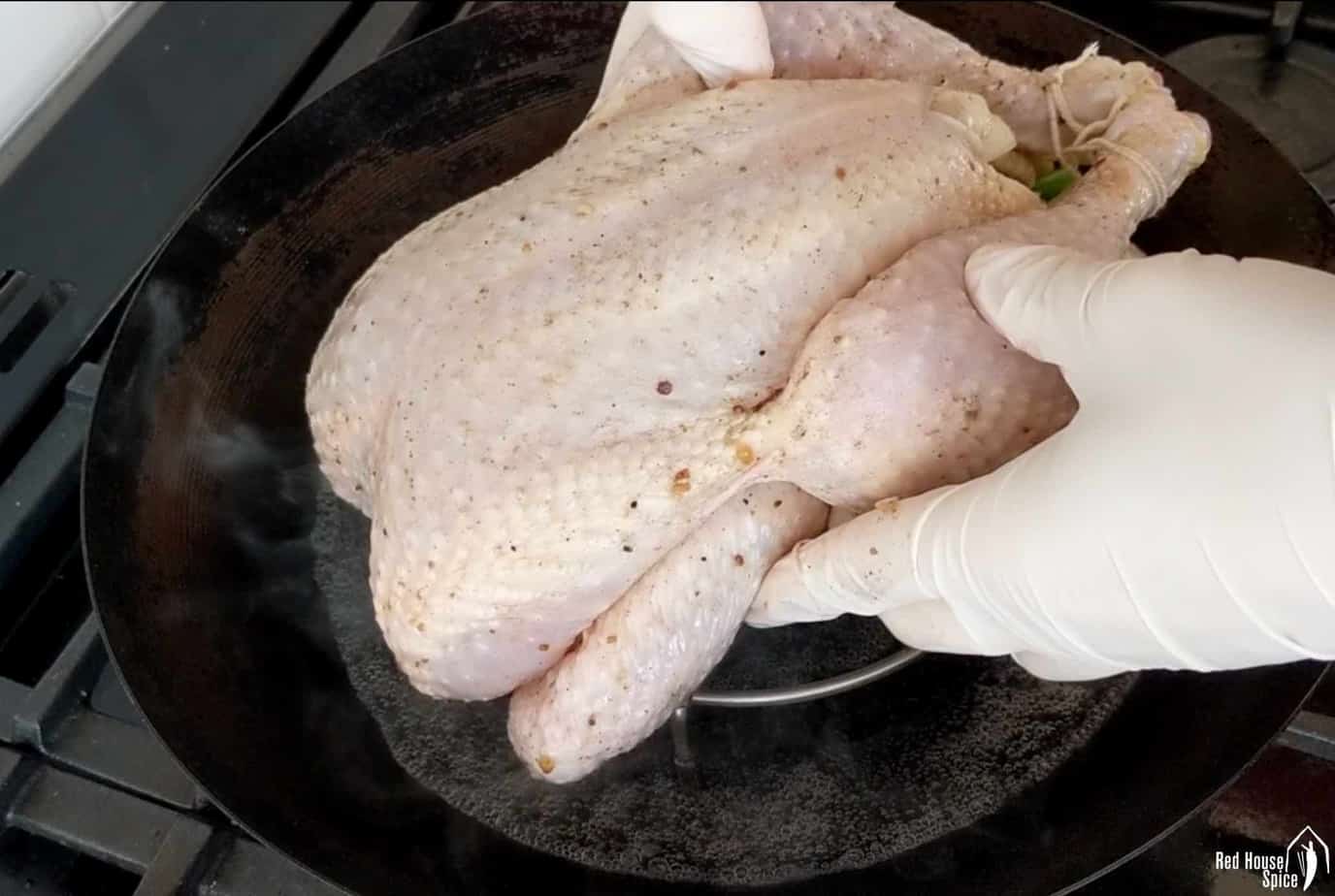 Putting chicken onto a steamer rack