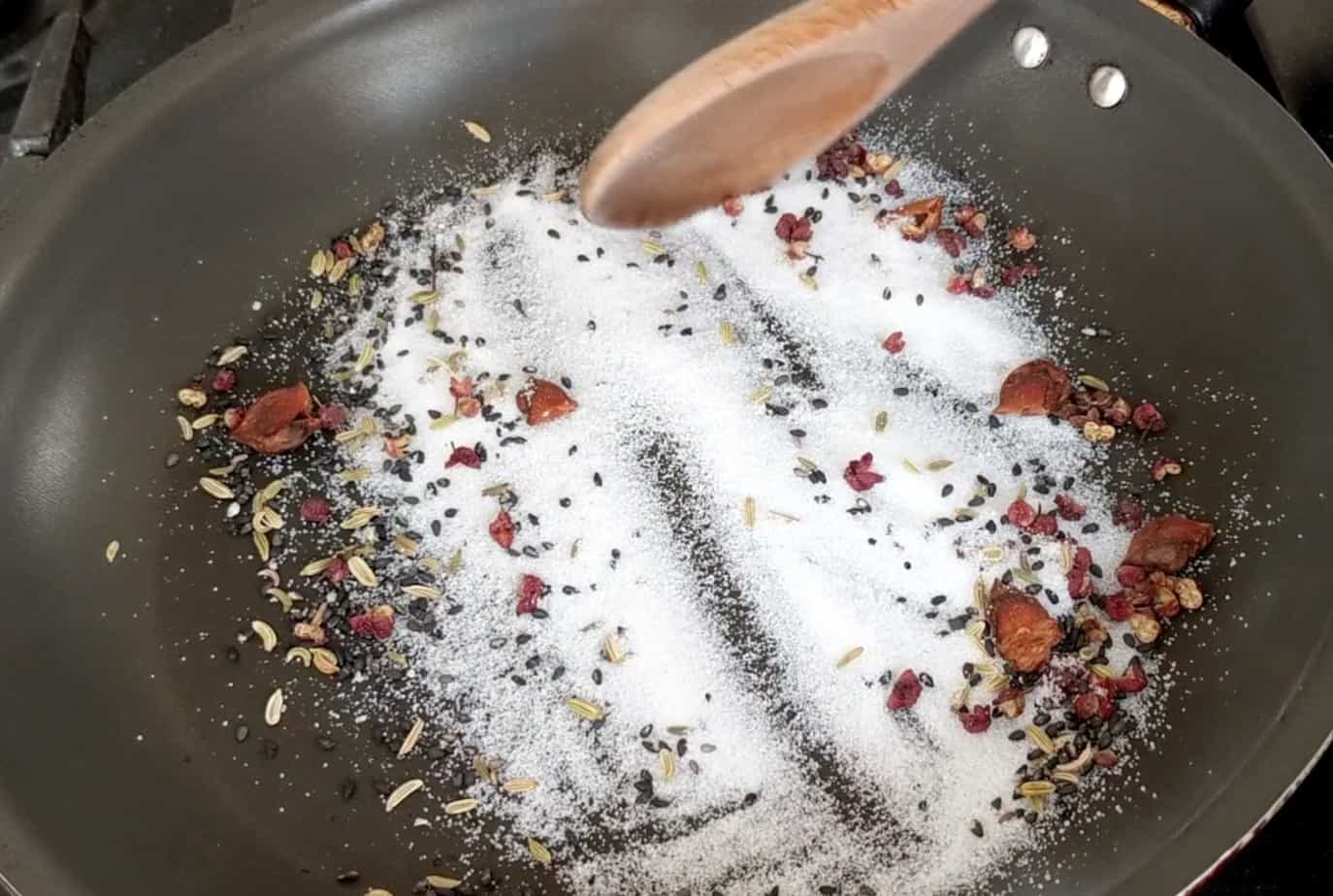 toasting salt and spices in a pan