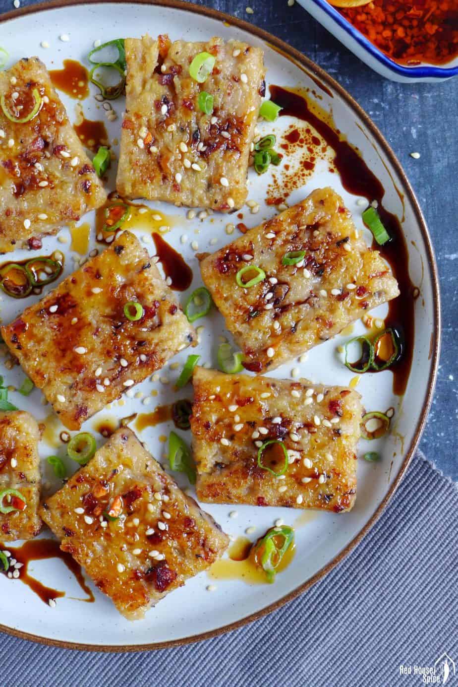 Chinese turnip cake slices with soy sauce and chili oil