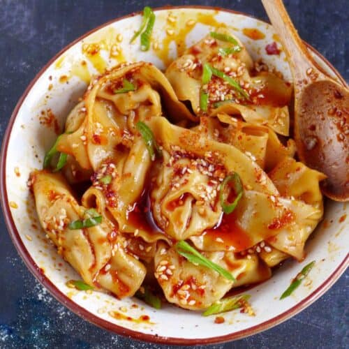 A bowl of spicy wontons