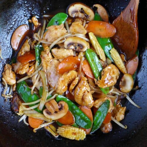 Frying chicken chop suey in a wok