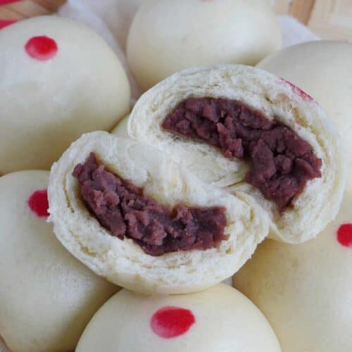 Red bean buns with one halved.