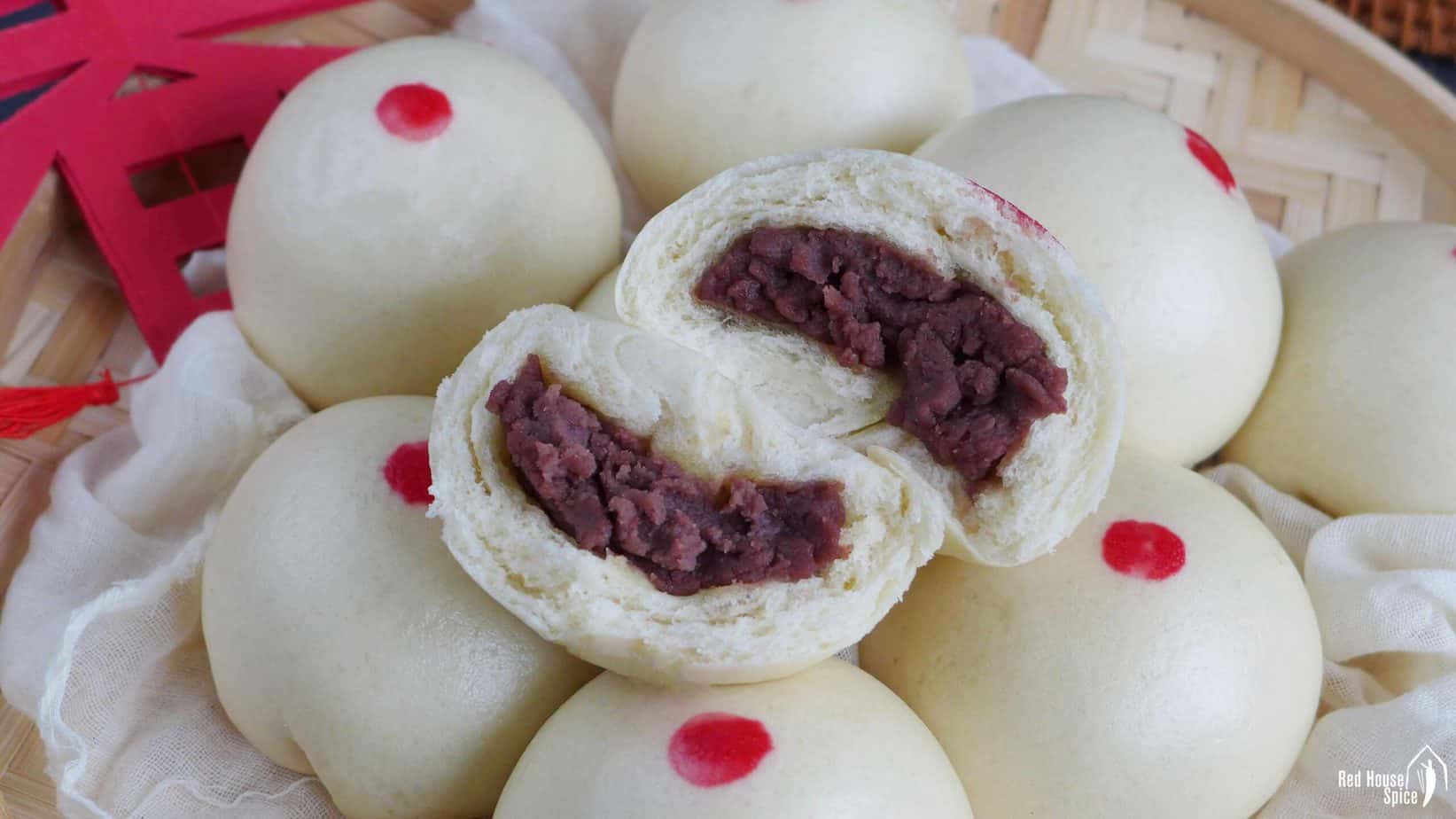 Red bean buns with one halved.
