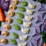 dumplings made in four colours: orange, green, white and purple
