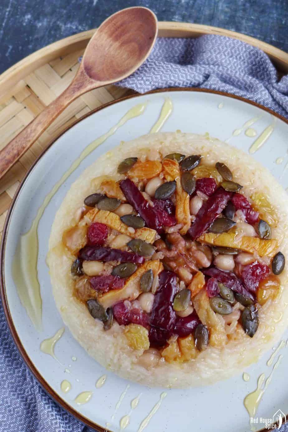 Eight treasure rice pudding topped with dried fruits and nuts