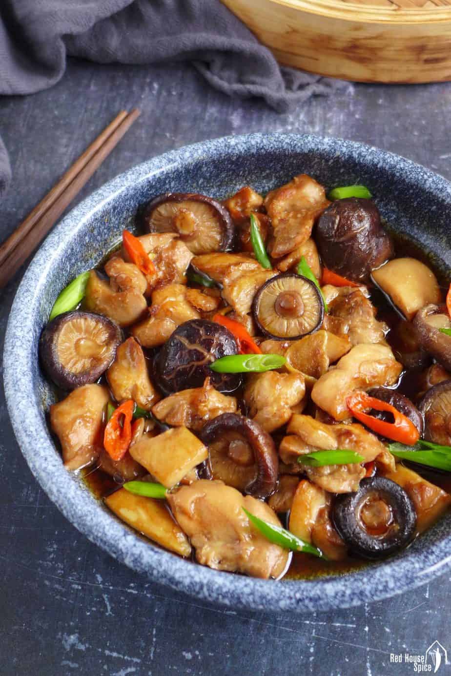A plate of Chinese steamed chicken with shiitake mushroom
