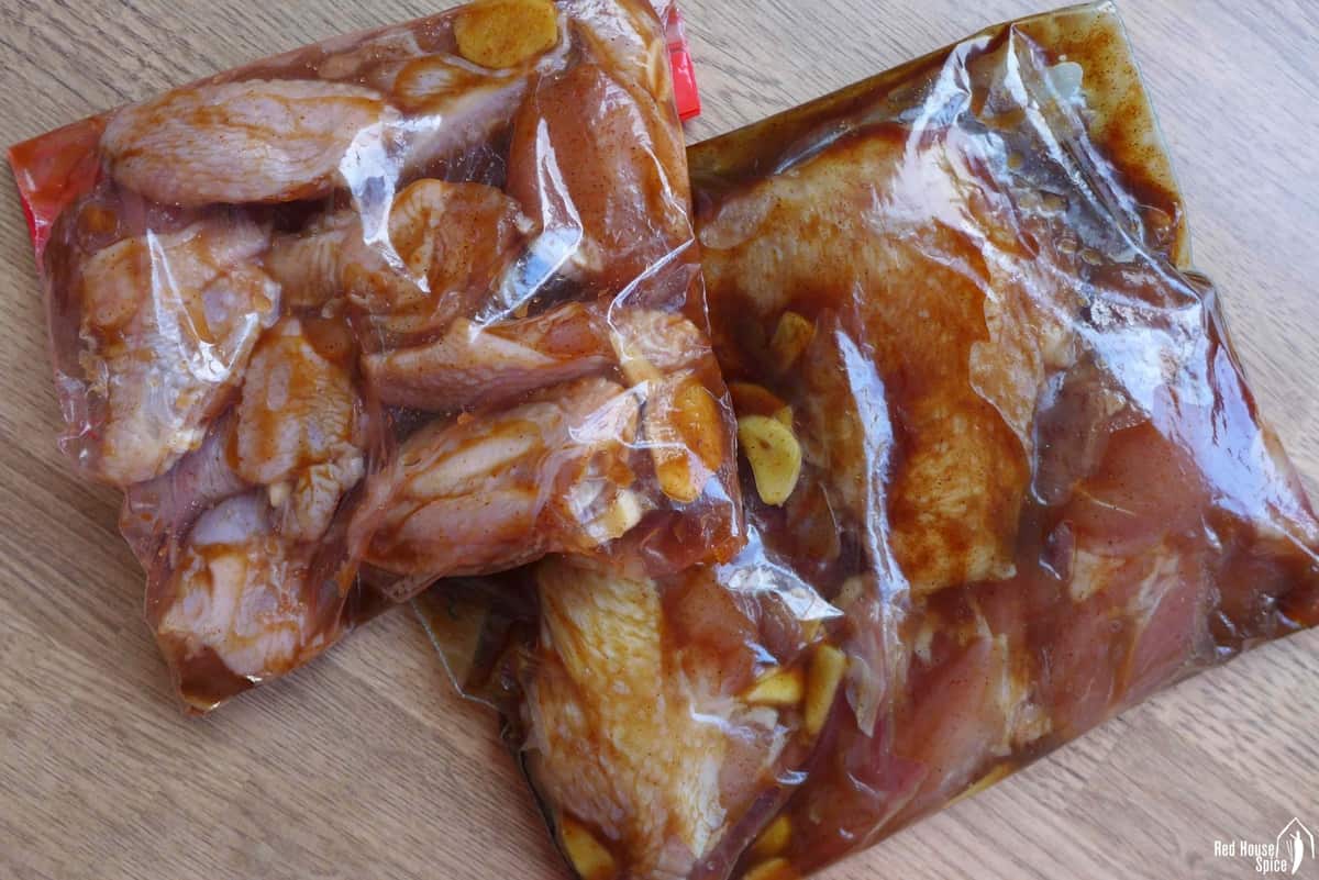 chicken with marinade in two plastic bags