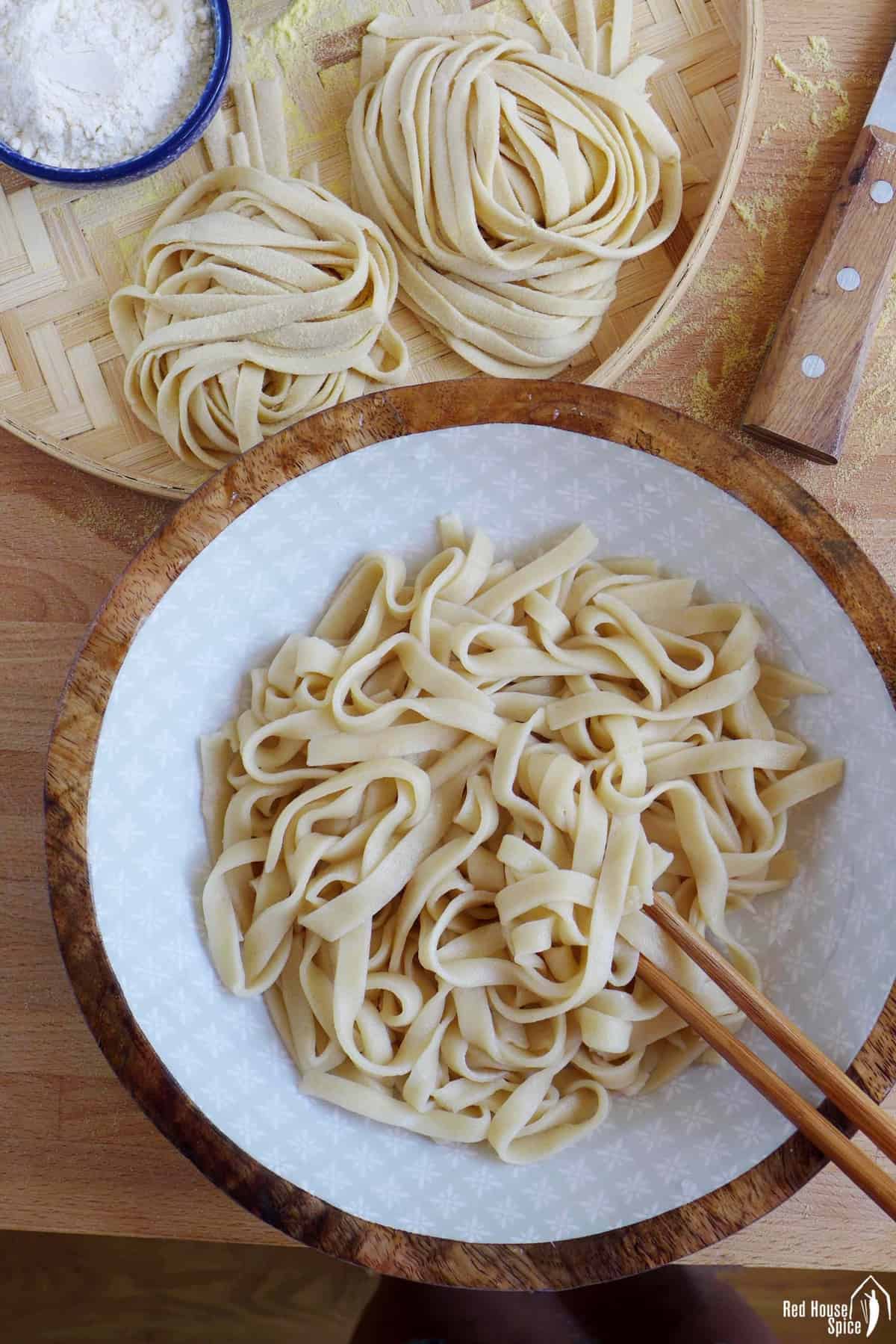 uncooked and cooked homemade noodles
