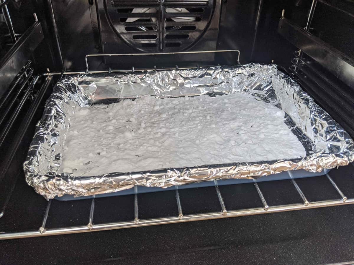 baking soda on a tray inside an oven