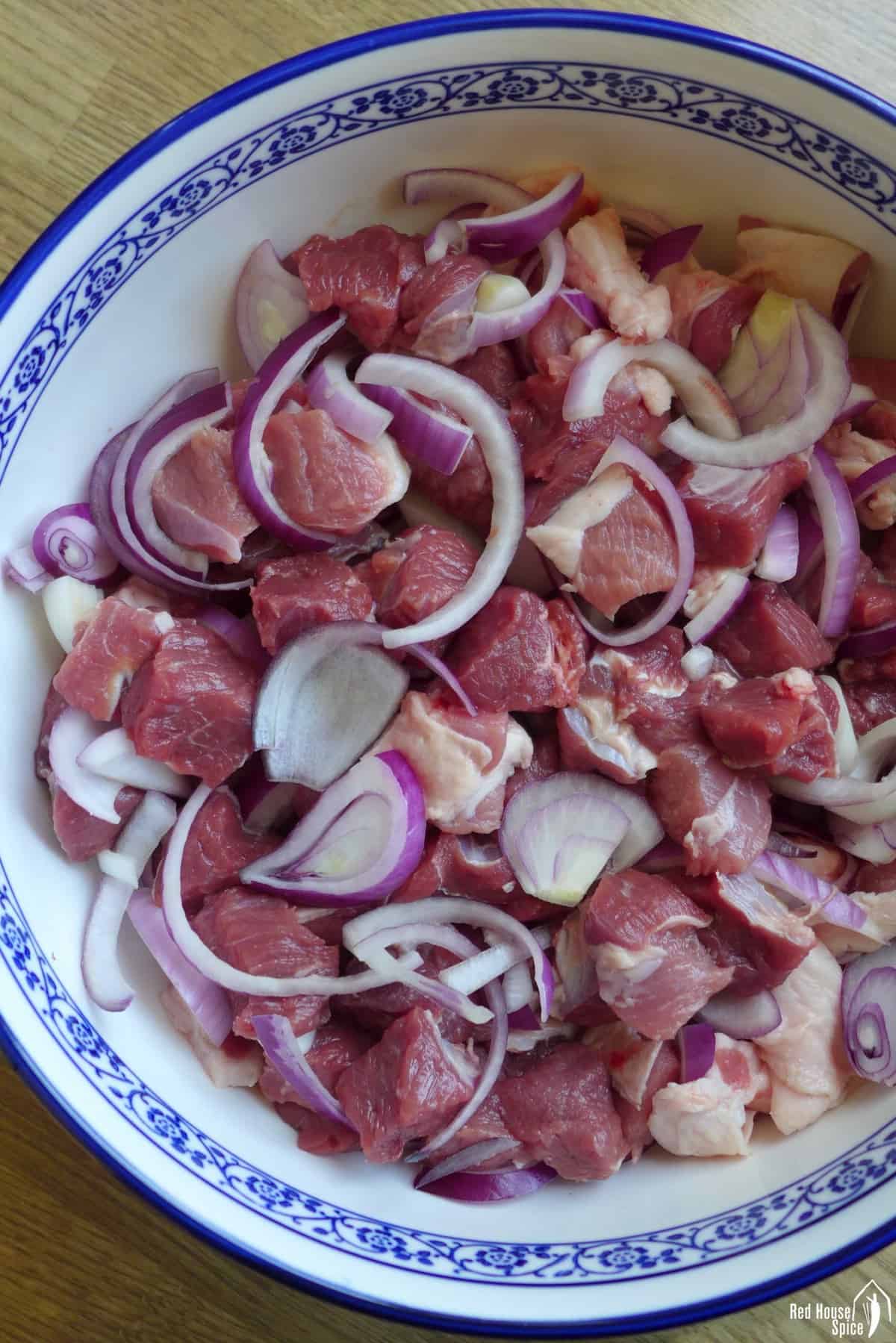 lamb cubes with sliced onion