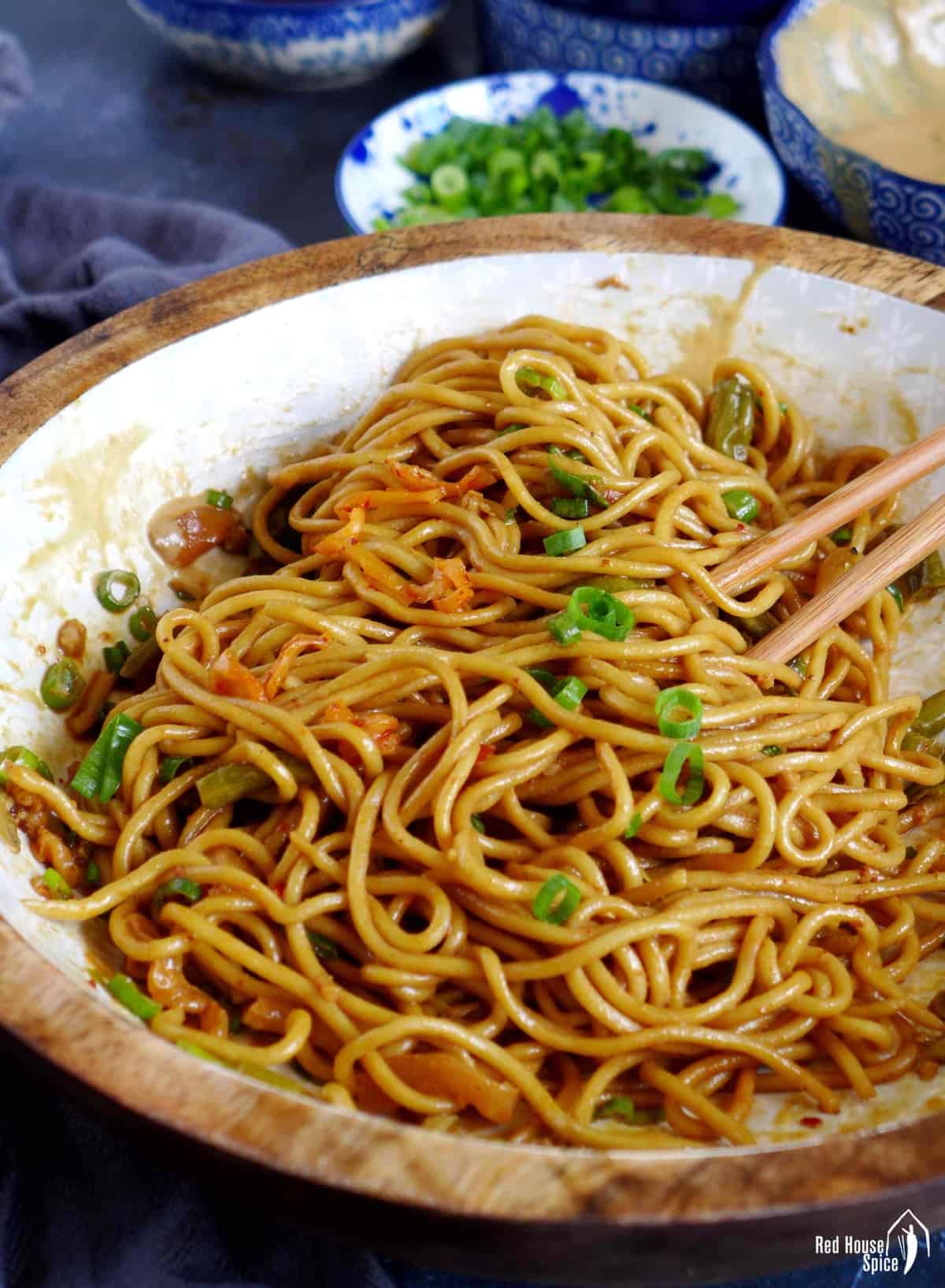 Hot dry noodles with sesame paste dressing and scallions