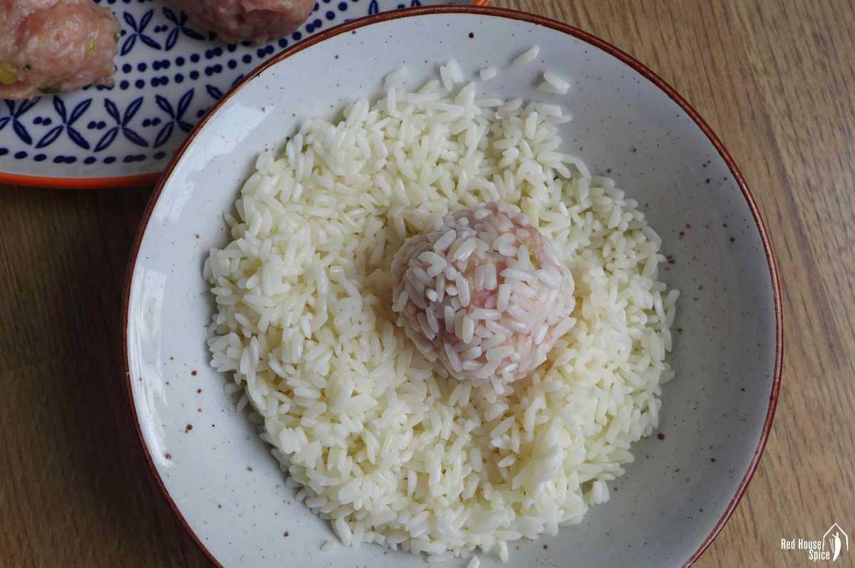 coating rice over a meatball
