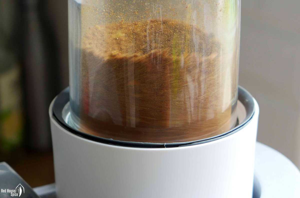 Grinding spices in a grinder.