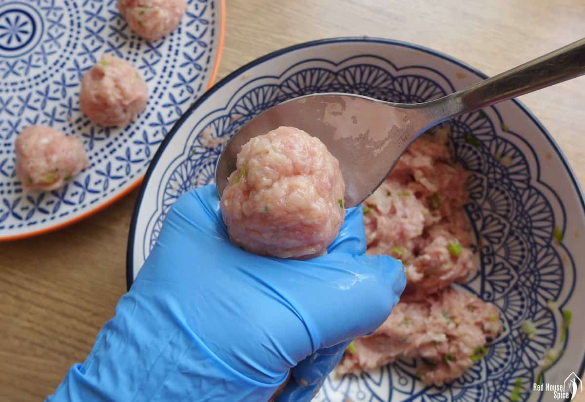 shaping meatballs with hands