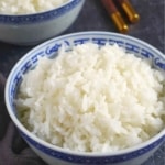 A bowl of cooked jasmine rice with overlay text that says perfect jasmine rice.