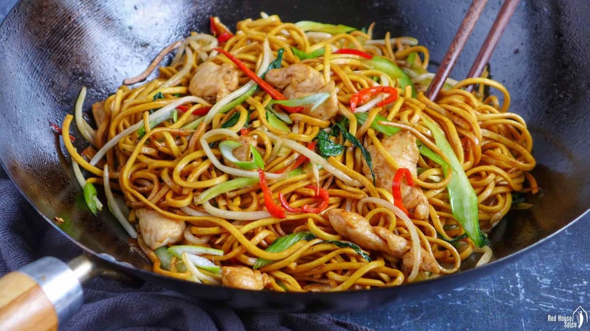 chicken chow mein in a wok.