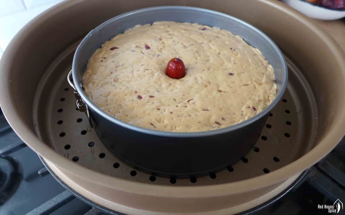 A raw Chinese New Year cake in a steamer.