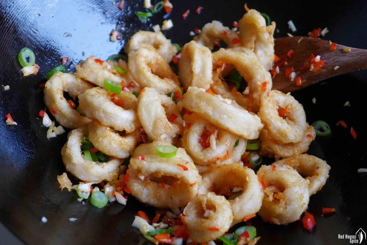 Stir frying squid with aromatics