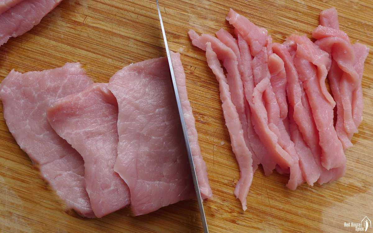 cutting pork into strips
