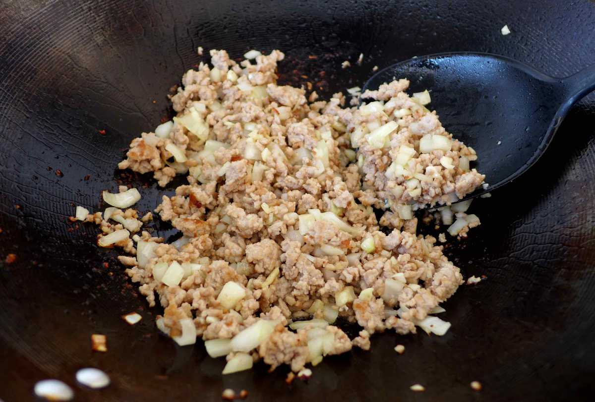 frying pork with onion, garlic and ginger