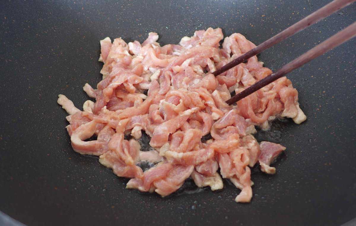 pork strips in a wok
