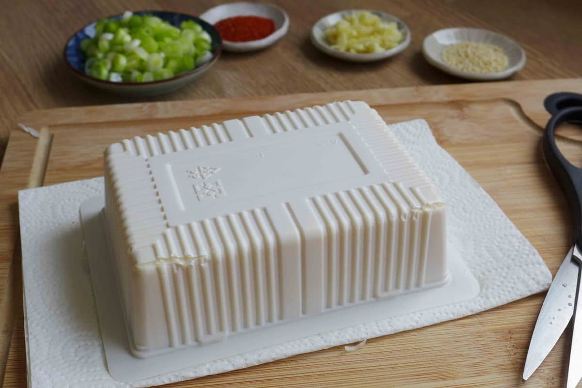 silken tofu box over kitchen paper