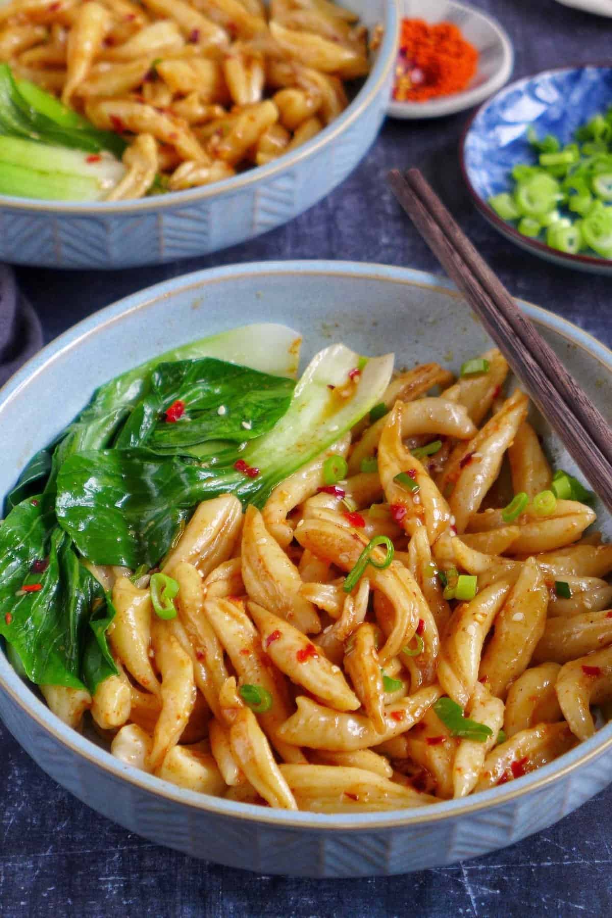 Scissor cut noodles with a spicy dressing