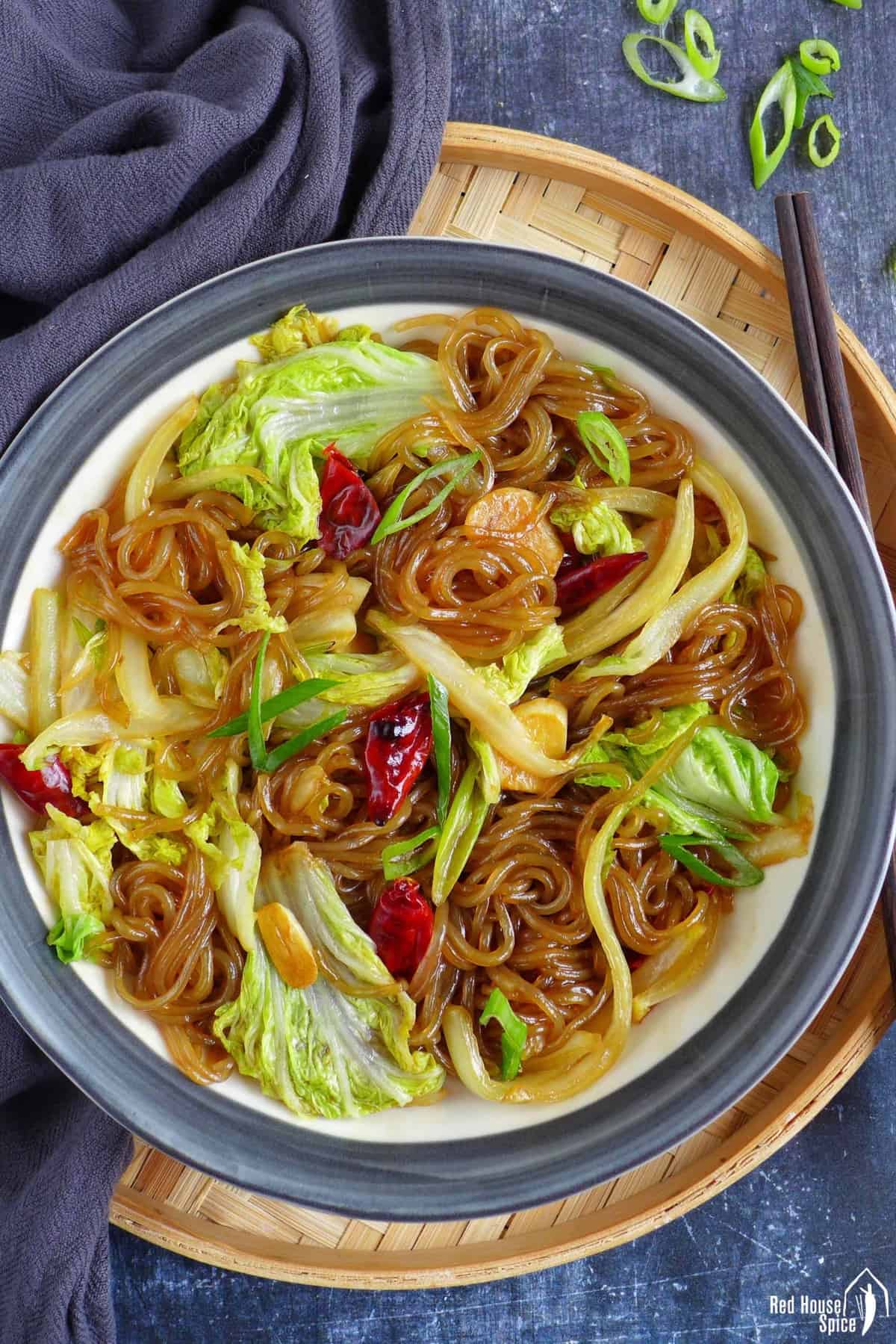 a plate of glass noodles braised with Napa cabbage